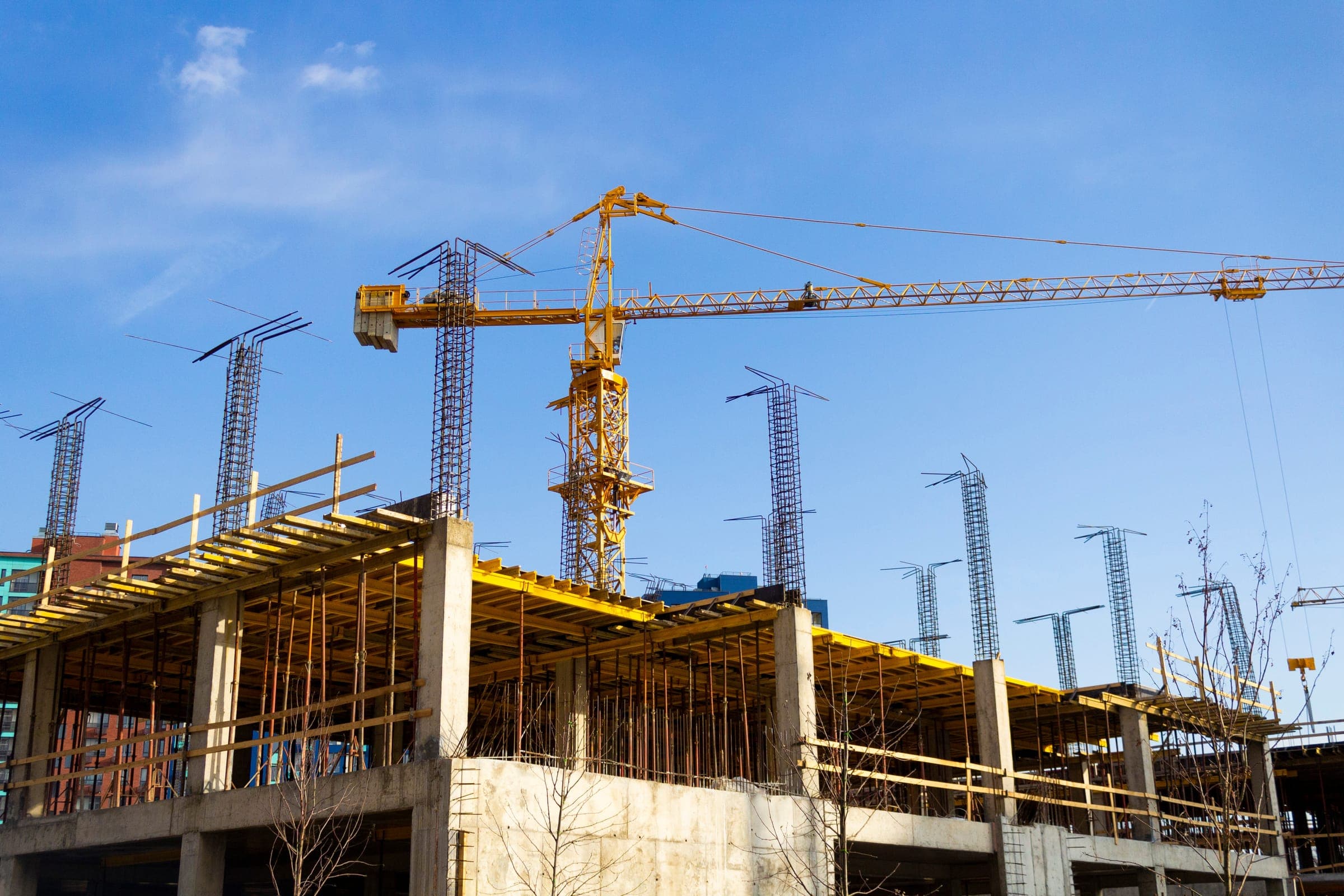 Tower crane over a concrete frame on a Texas construction site